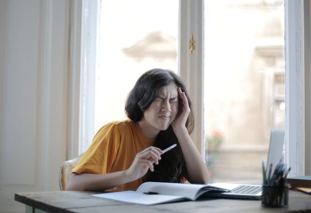 Female student suffering from pain